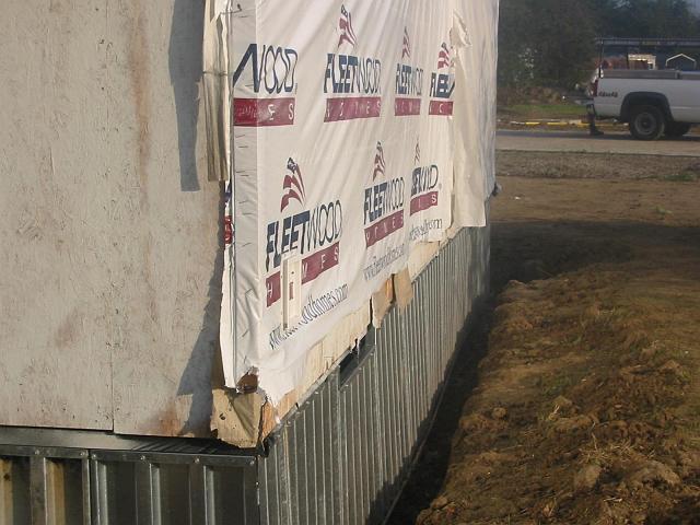 Stucco 1 Panels have been hung from a couple of homes that will get a one-coat stucco over each home and foundation wall.